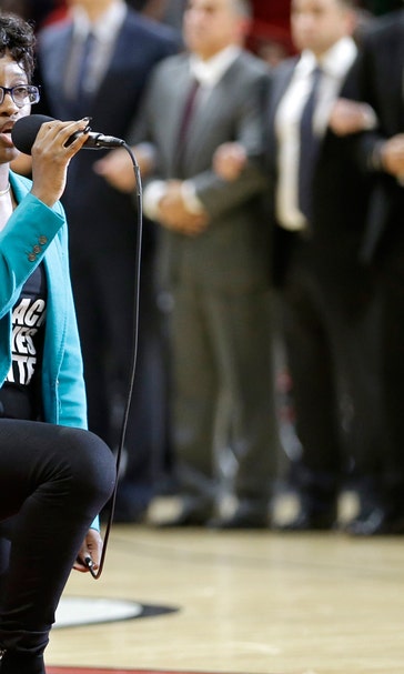 Anthem performer before Heat game kneels while singing